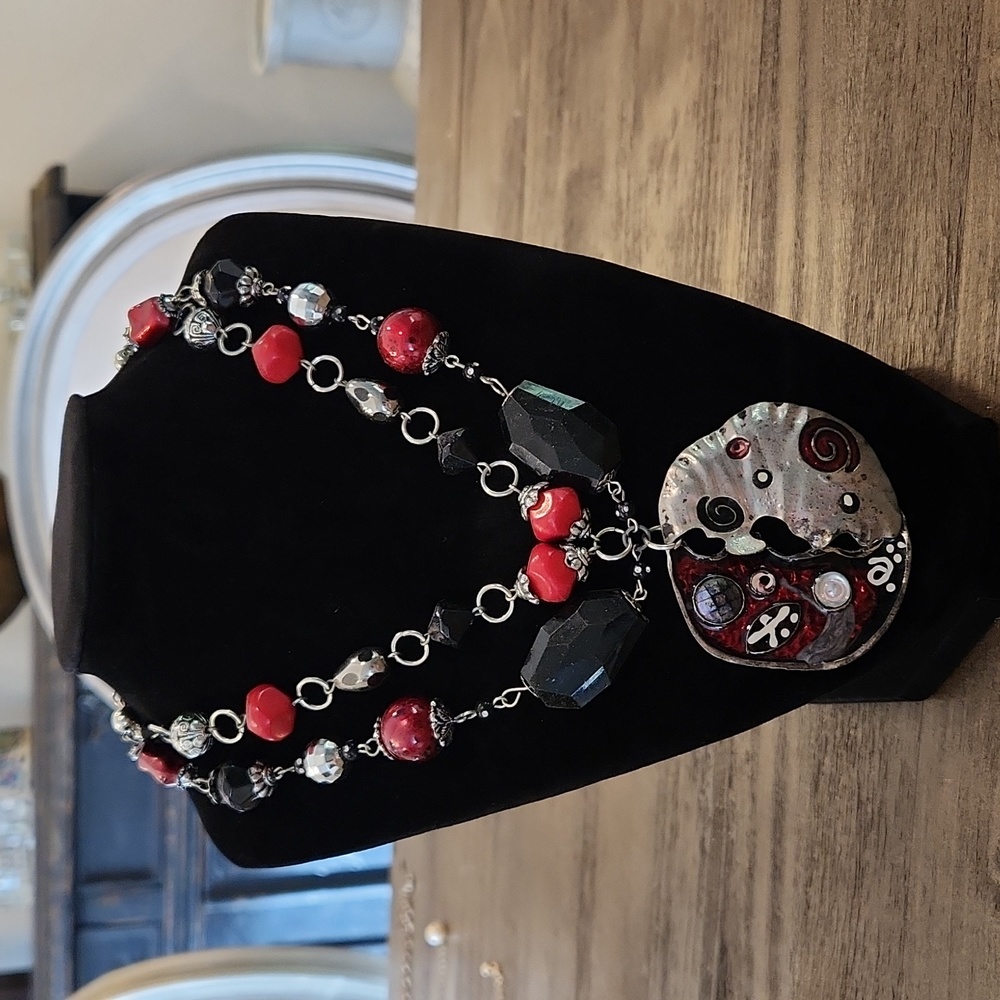 Very artsy silver black and red necklace